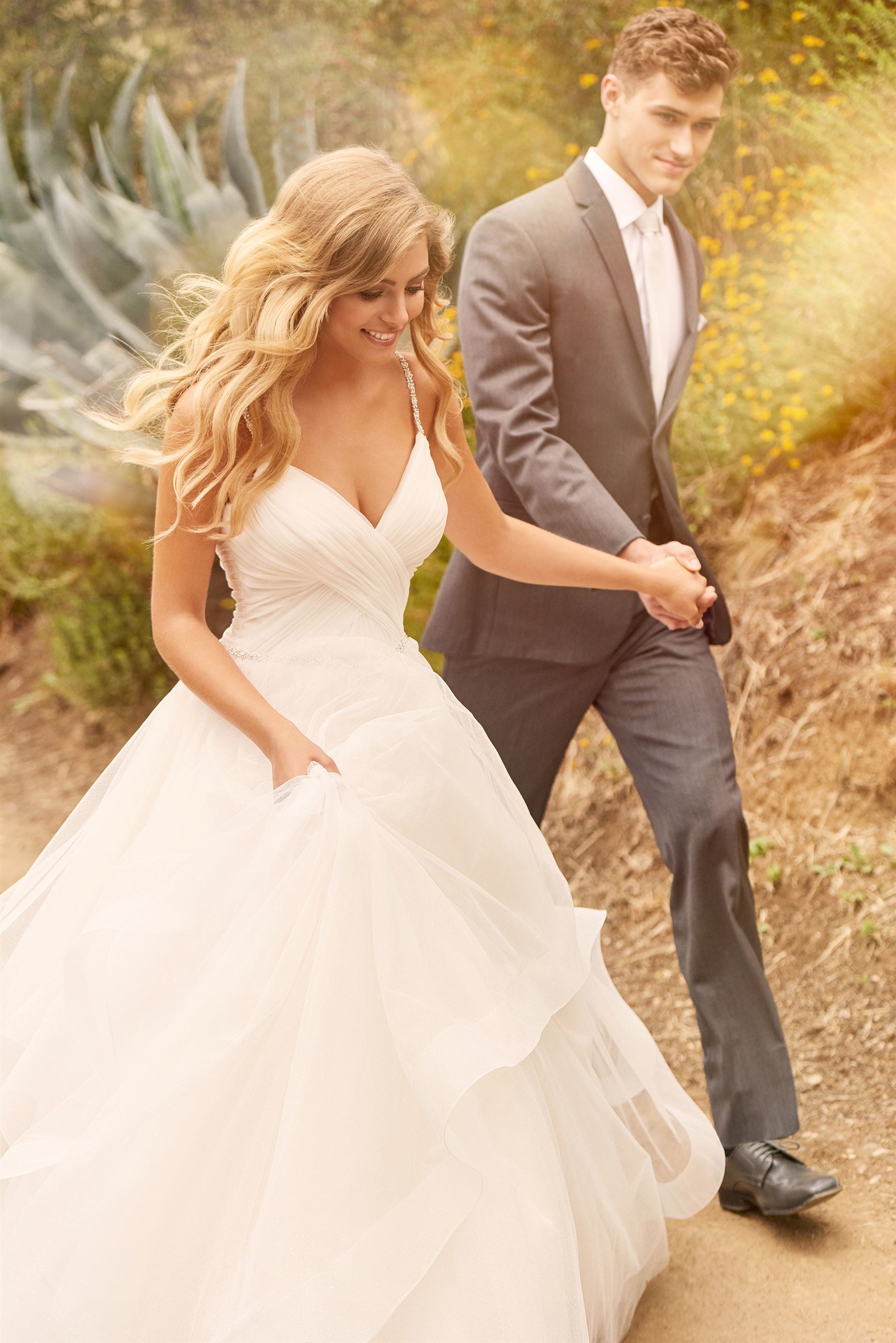 Bride wearing ruffled ball gown wedding dress