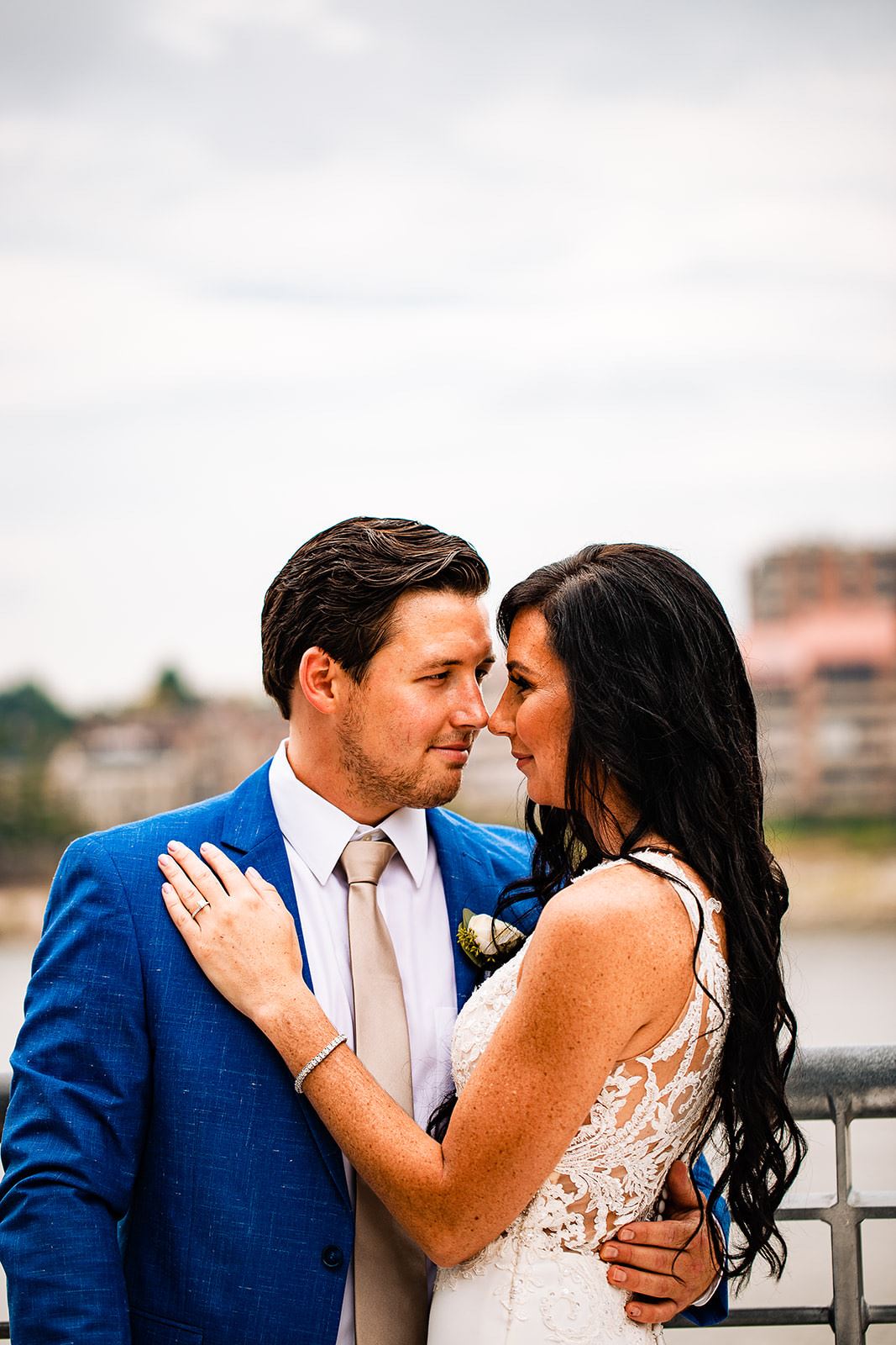 Bride and groom holding each other