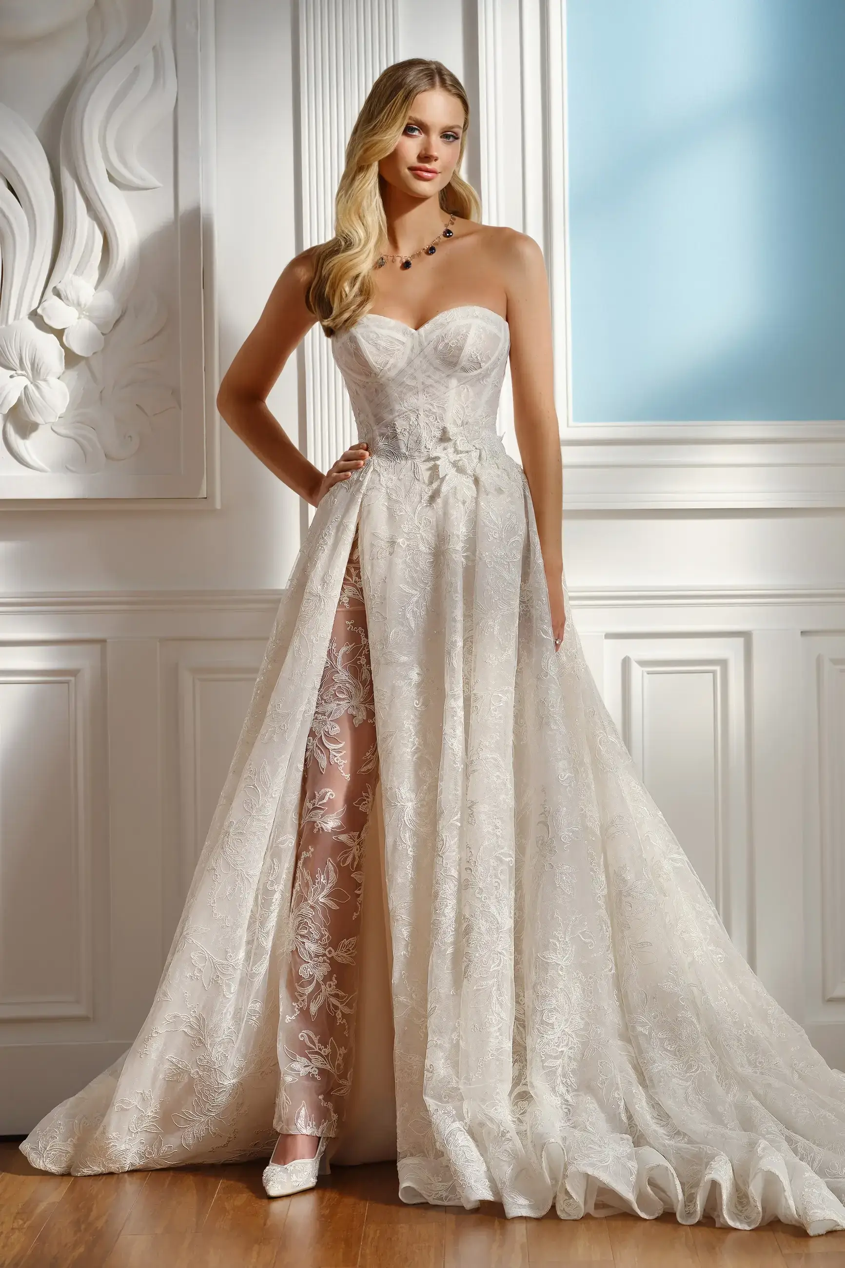 model is wearing a strapless a-line wedding gown