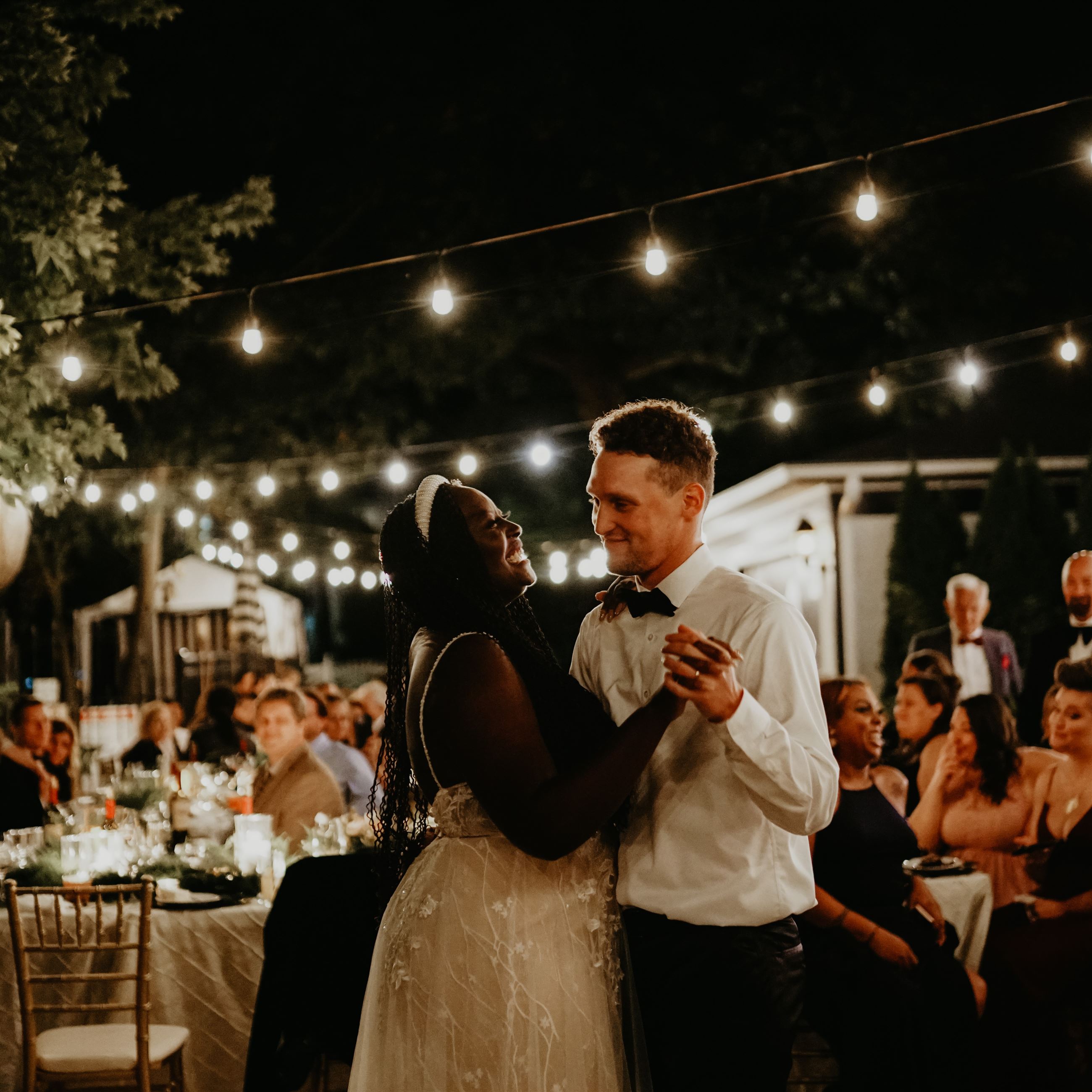 Close up of bride and groom dancing together at reception