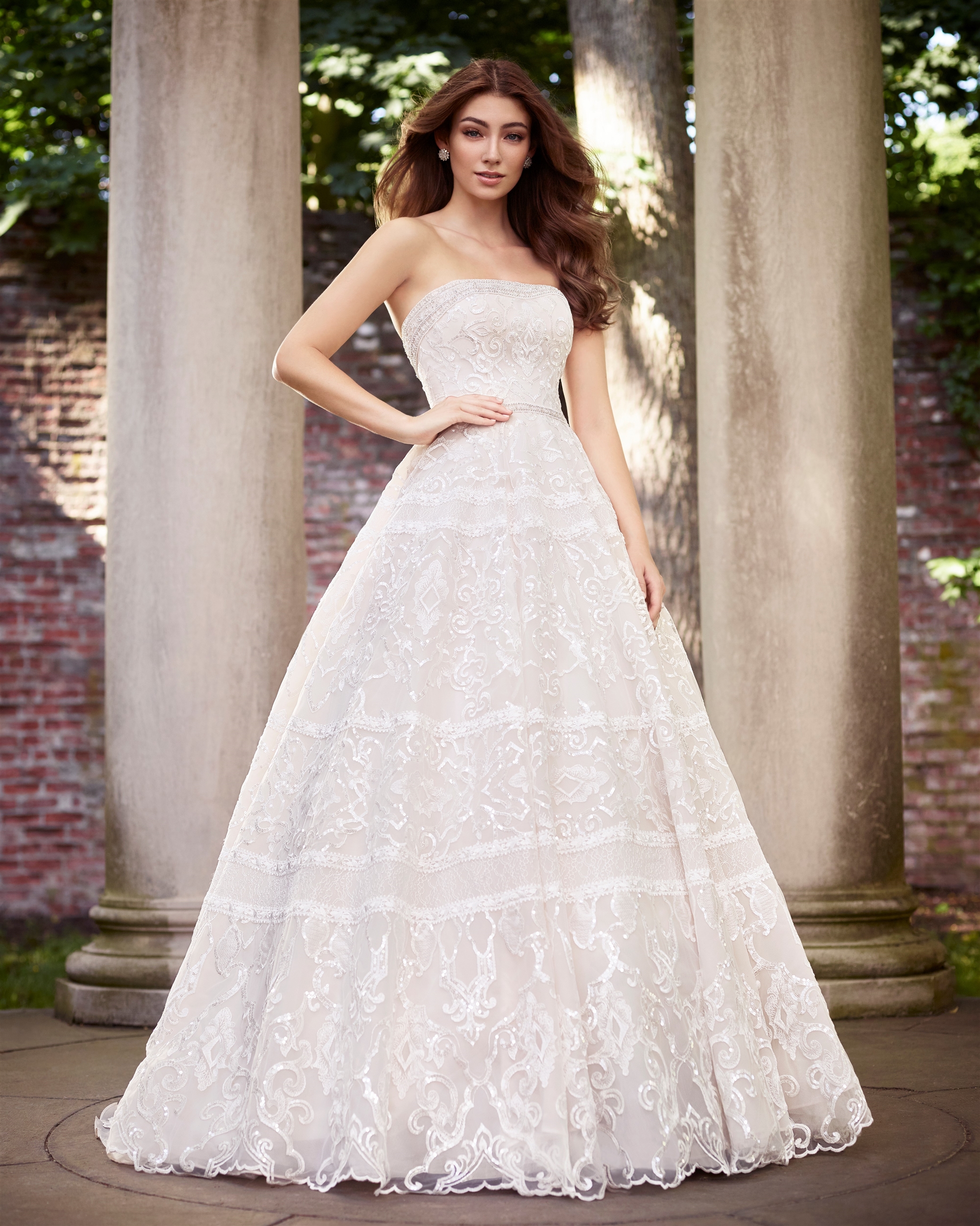 Brunette bride wearing boho strapless ball gown wedding dress