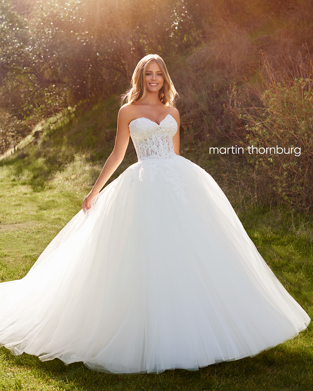 Bride wearing strapless ball gown wedding dress with corset