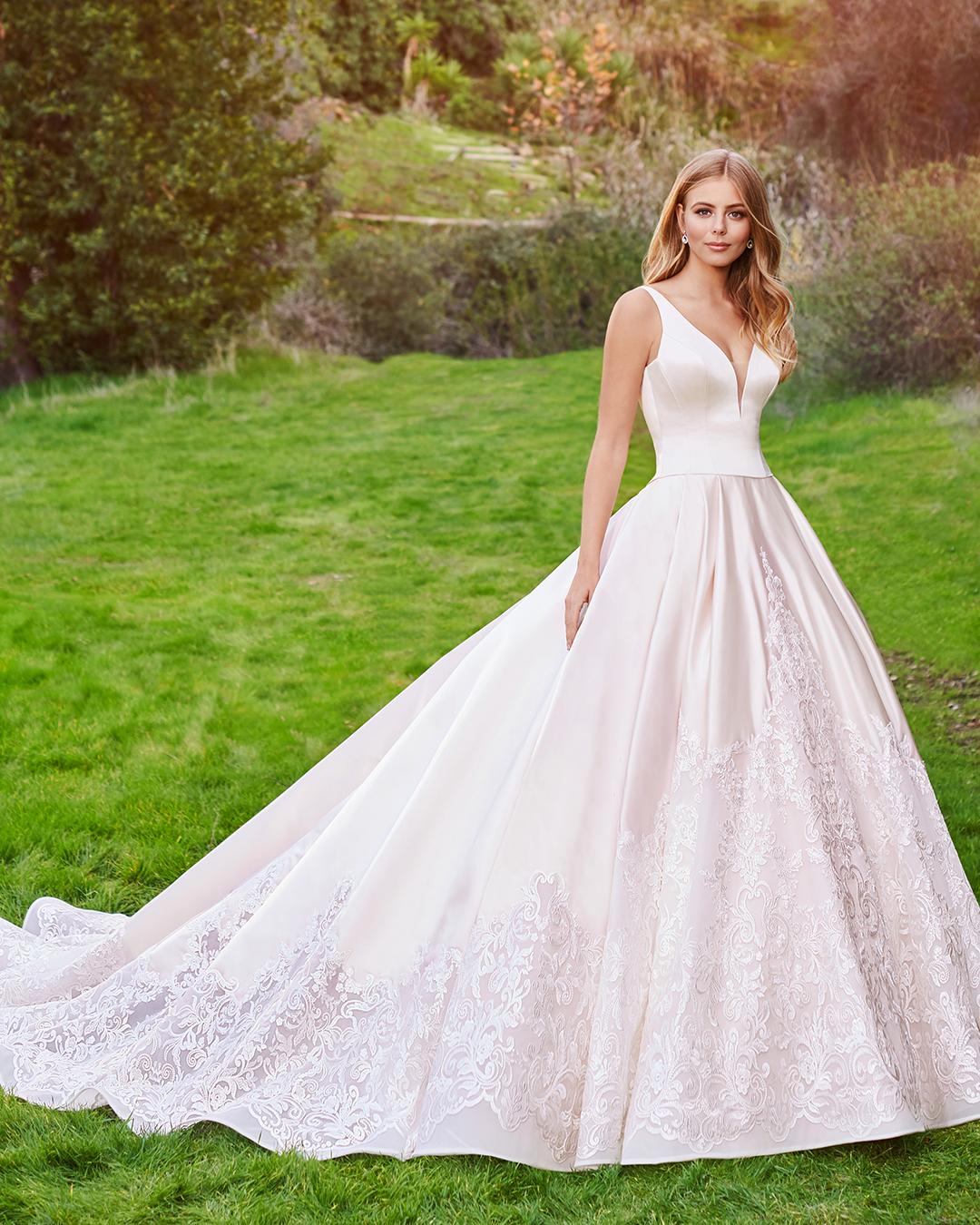 blonde bride wearing lace ball gown wedding dress