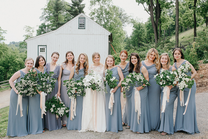 Bridesmaids Carry A Branch of Dogwood Blossoms