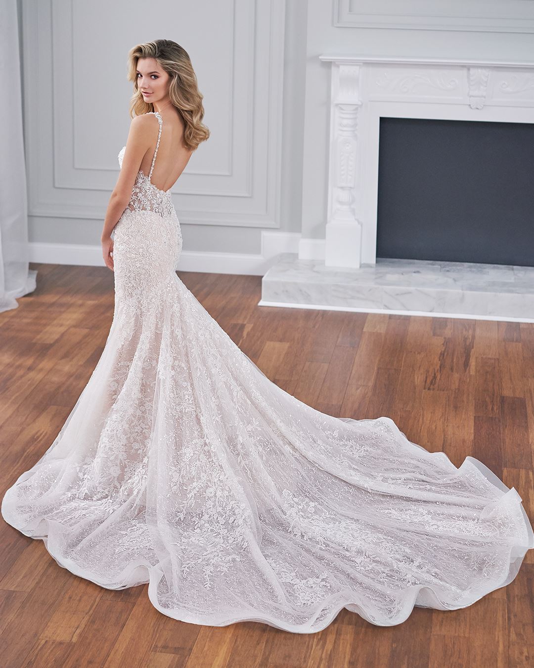 Bride wearing mermaid wedding dress with low back