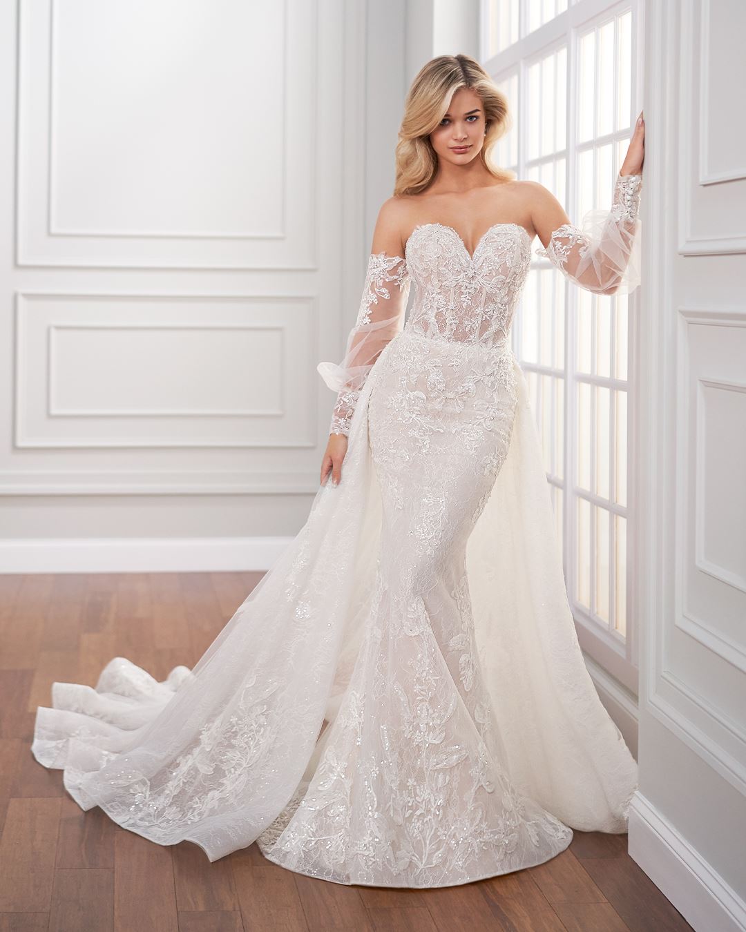 Bride wearing off the shoulder long sleeve wedding dress