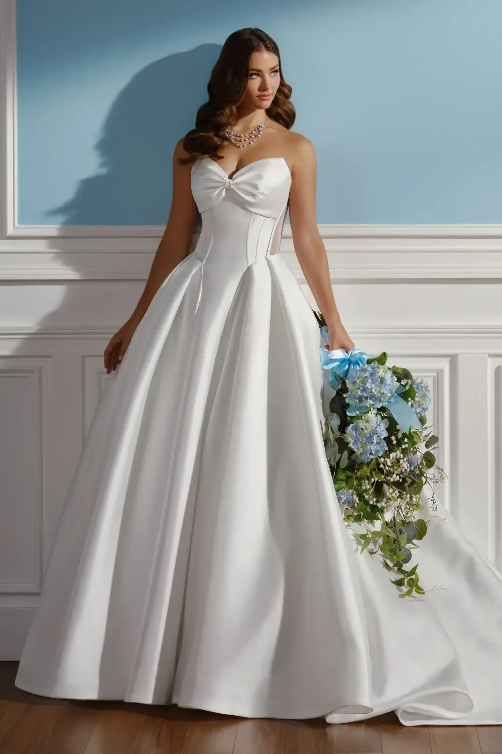 model is wearing a strapless mikado ball gown wedding dress