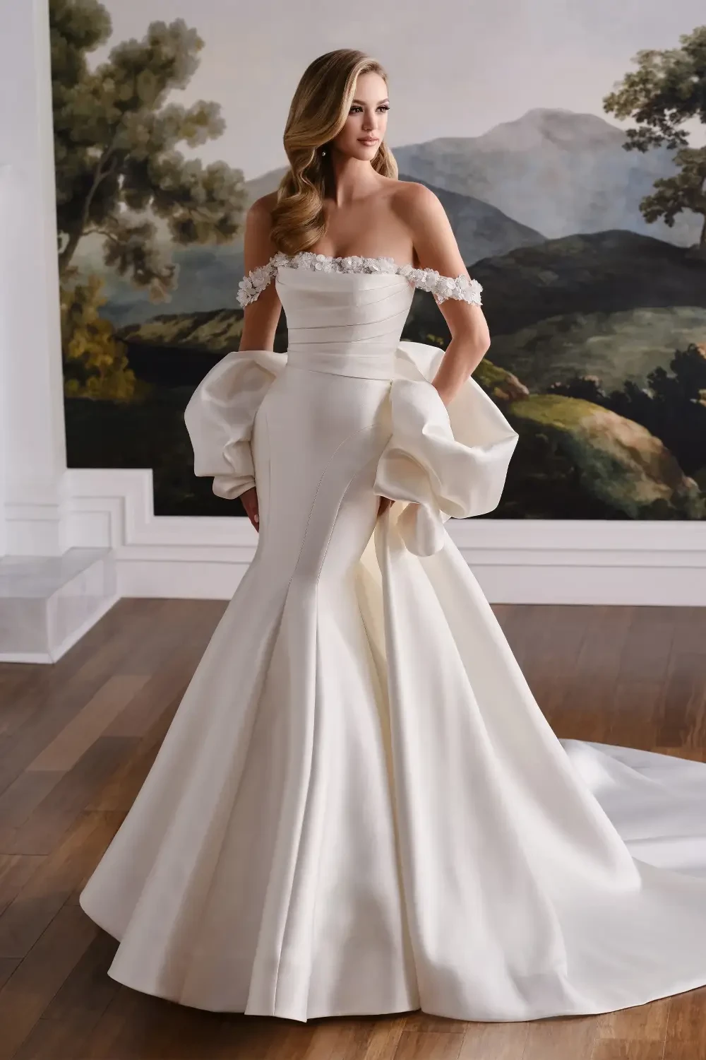 model is wearing a mikado fit and flare bridal gown