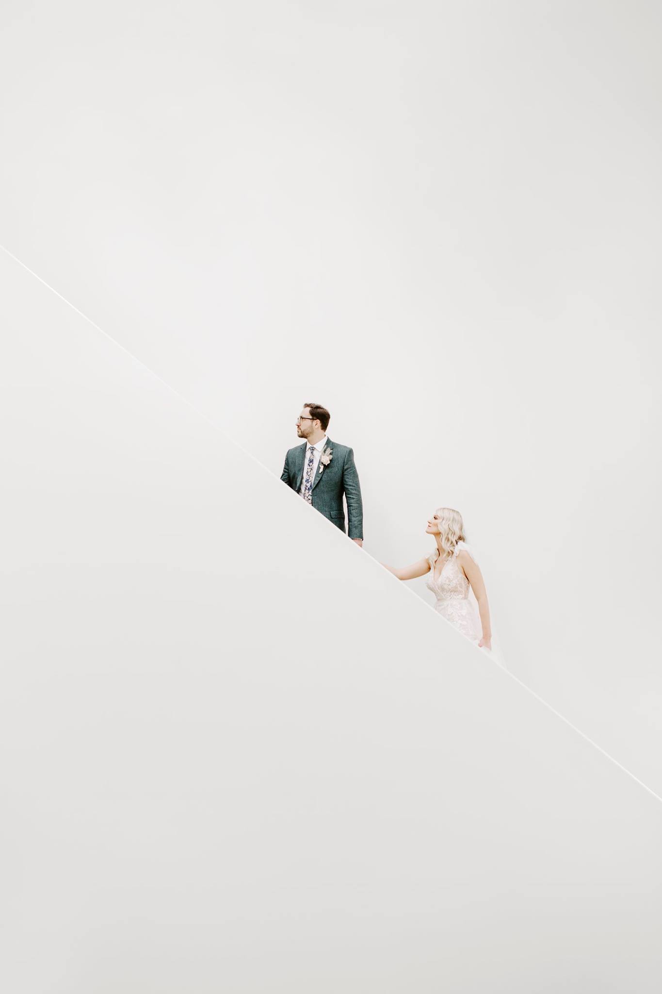 Bride and groom walking upstairs