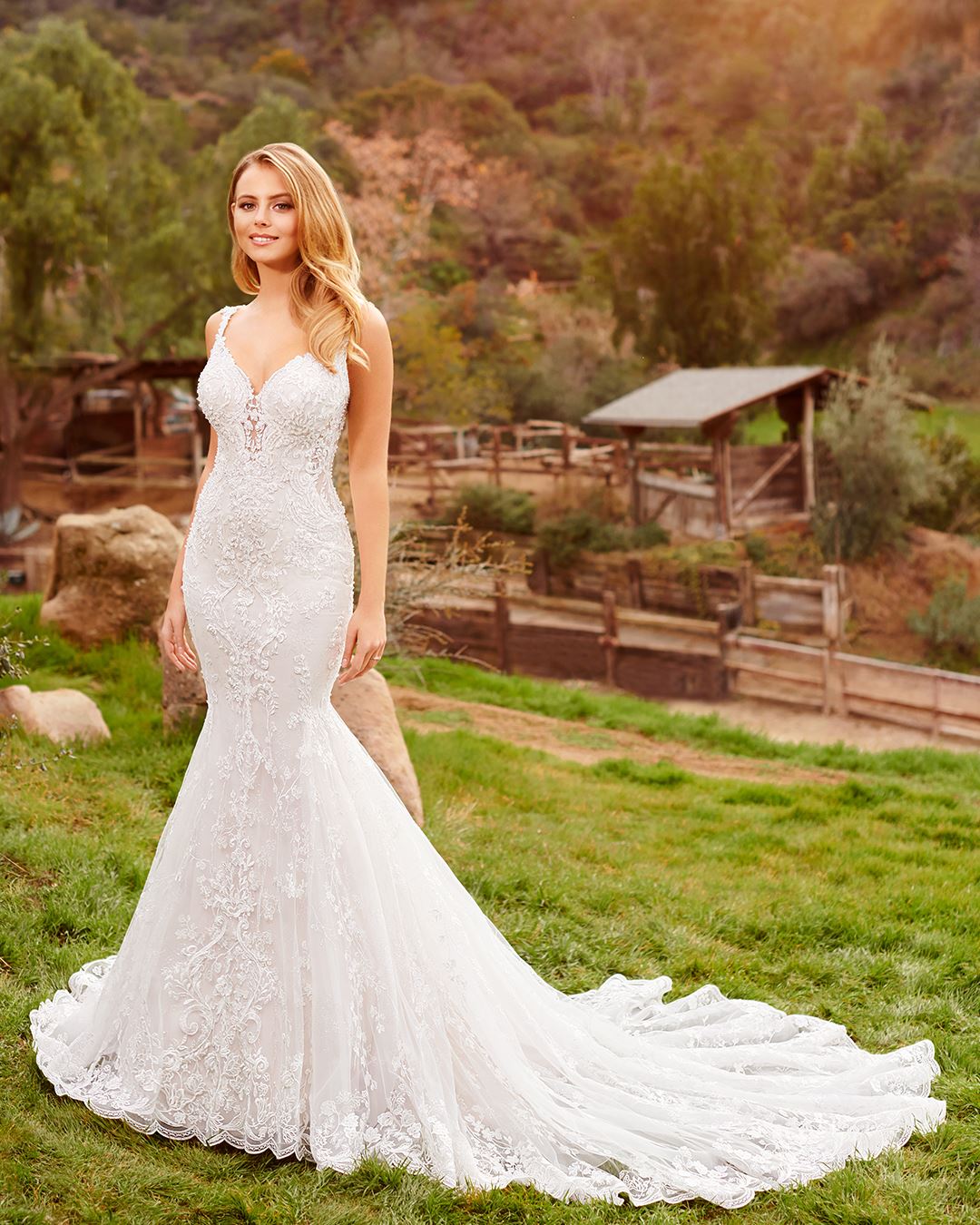 Bride wearing beaded lace mermaid wedding dress