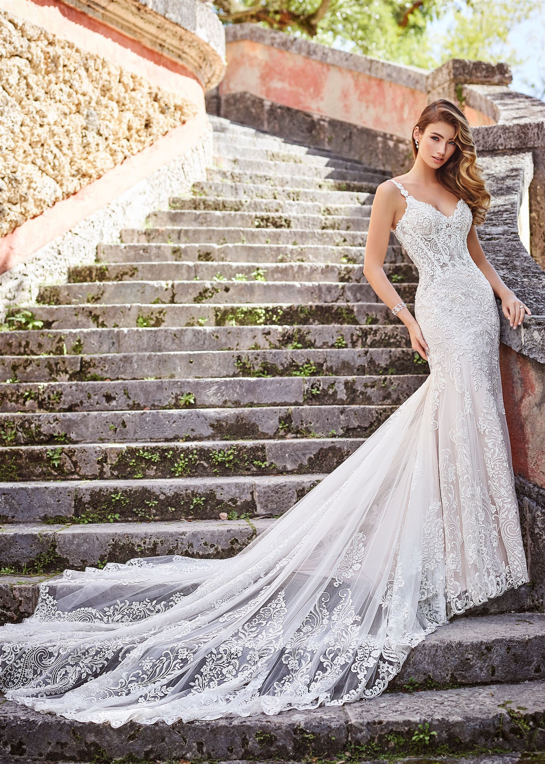 Bride wearing lace fit and flare wedding dress by Martin Thornburg