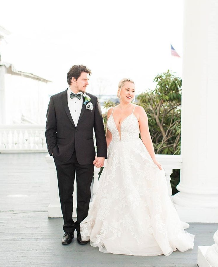 Bride and groom holding hands