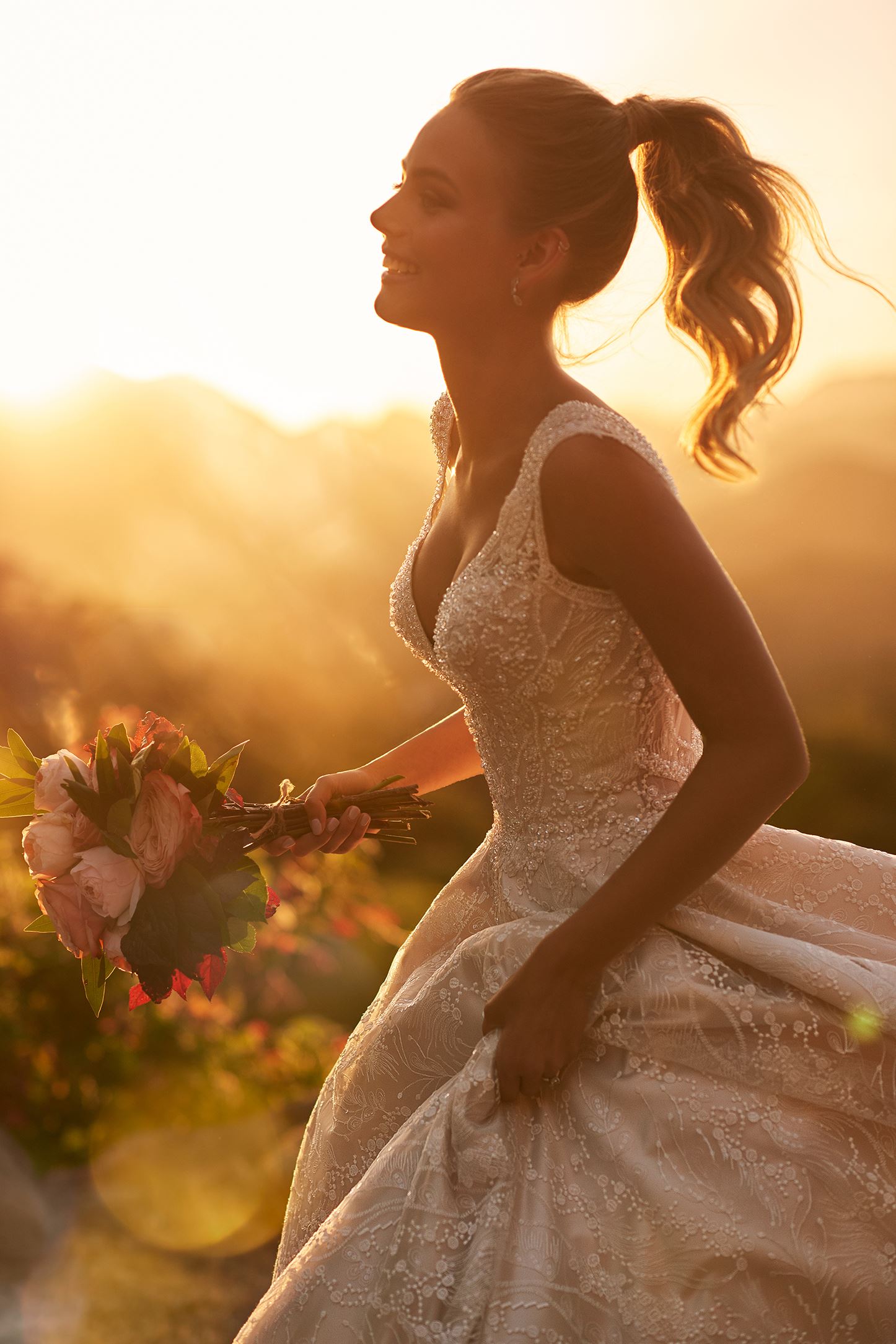 Blonde bride running in white wedding dress