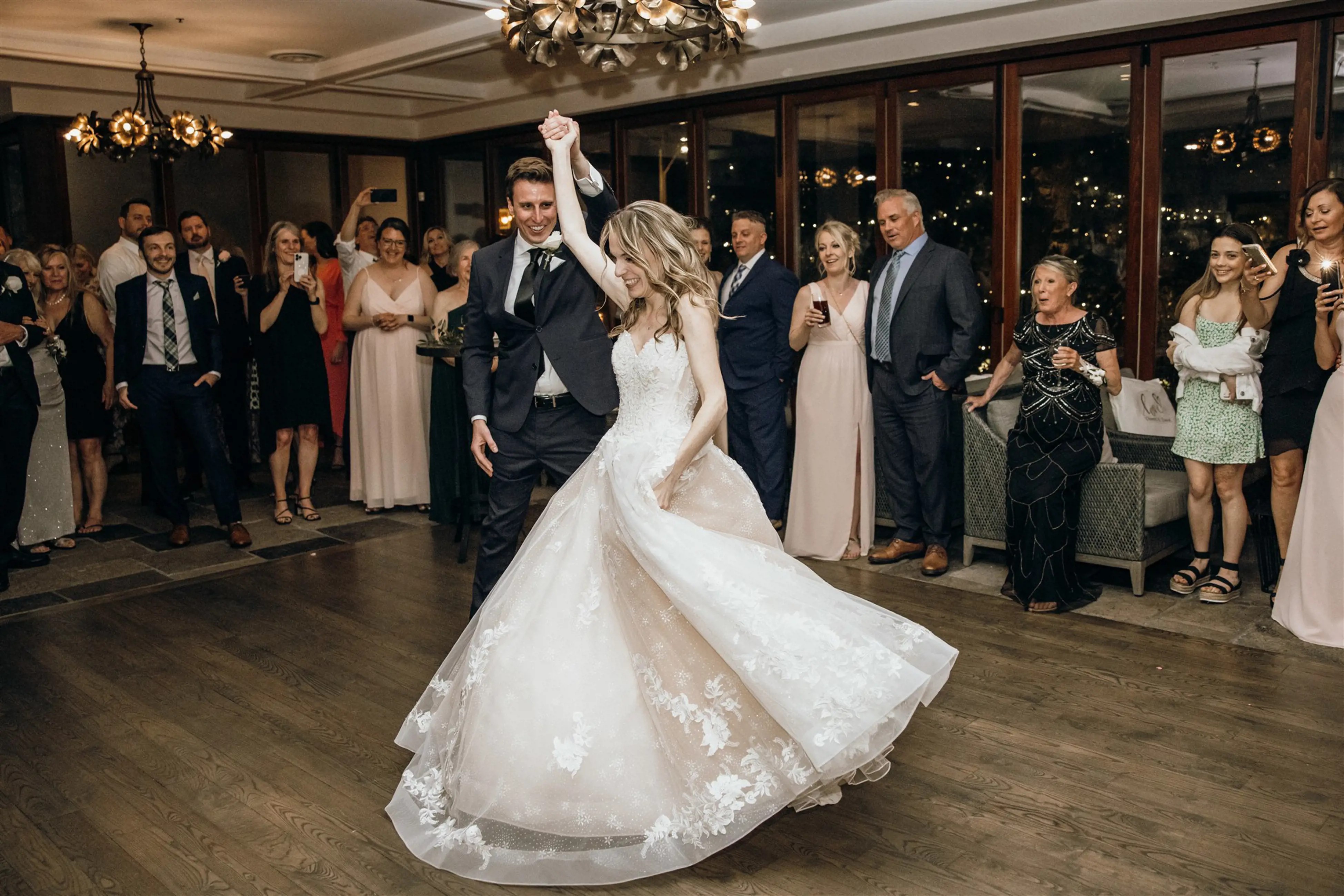 Dancing couple wearing a white gown and a black suit