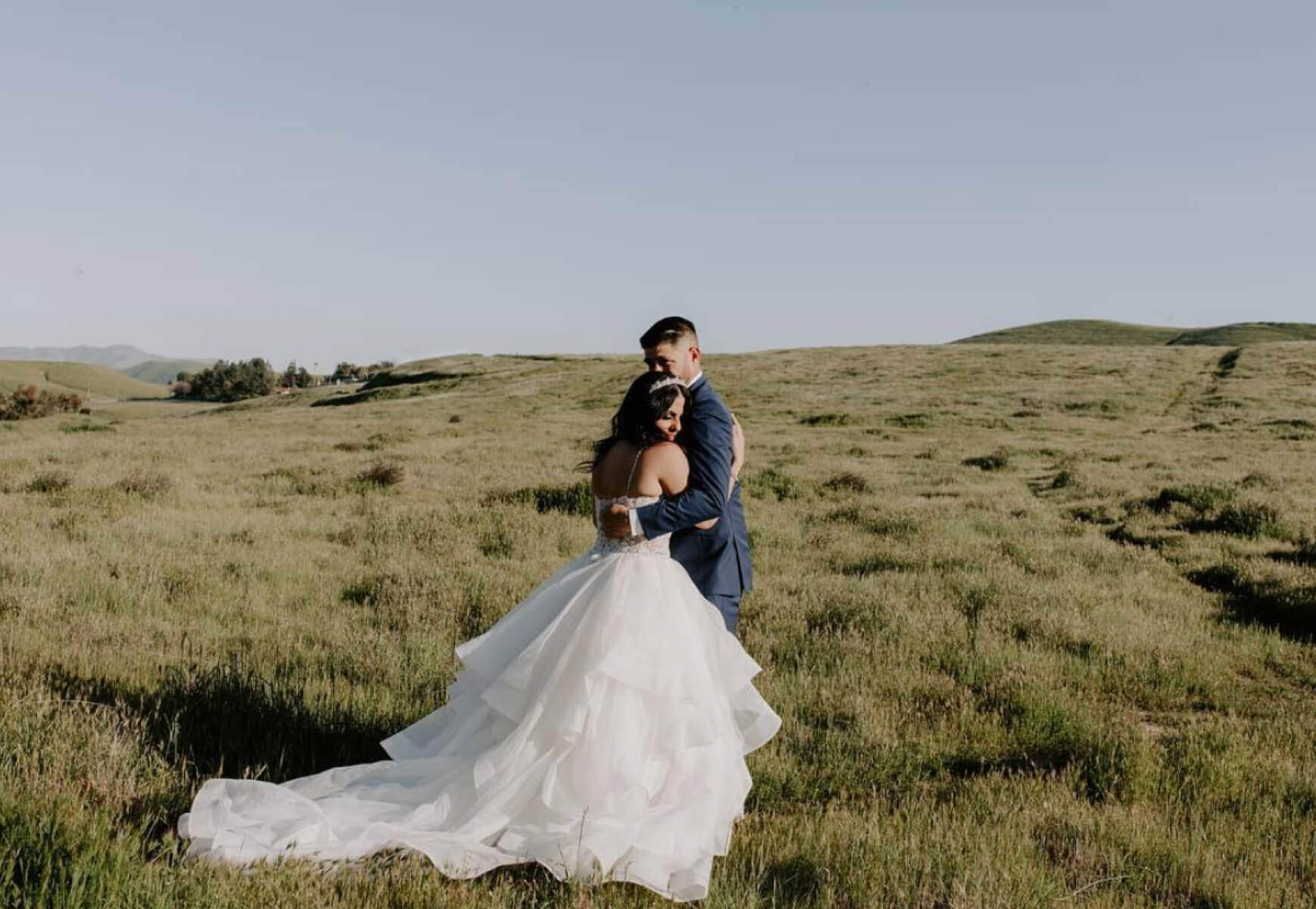 Bride and groom holding each other Desktop Image