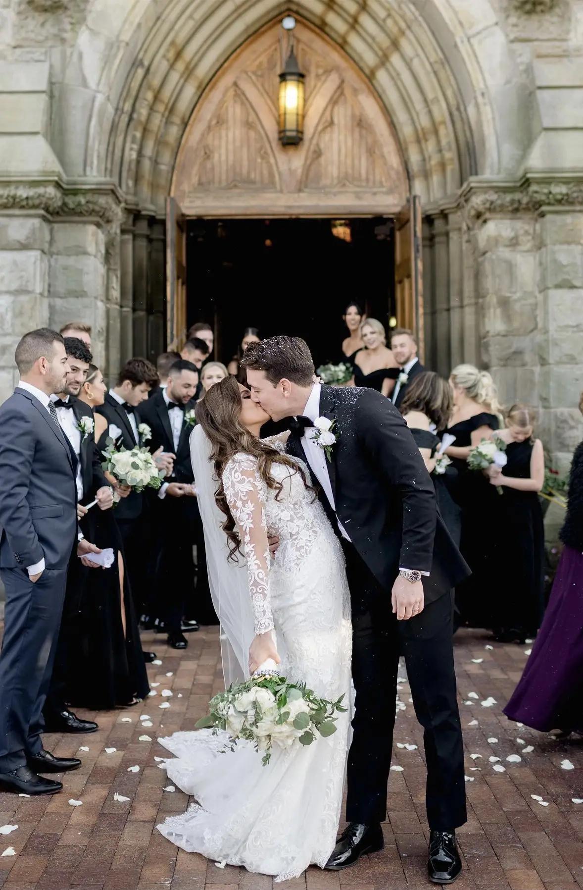 bride and groom kissing exit
