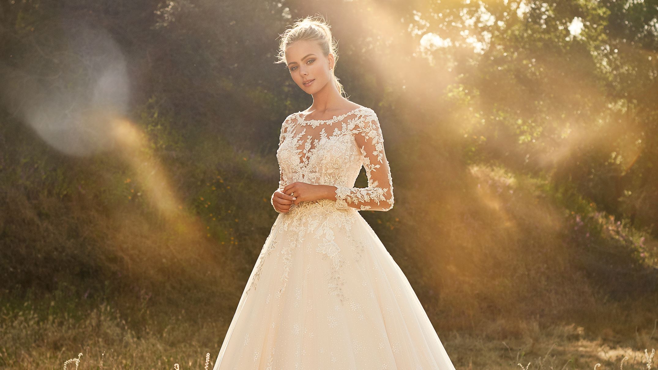 Blonde bride wearing long sleeve wedding dress