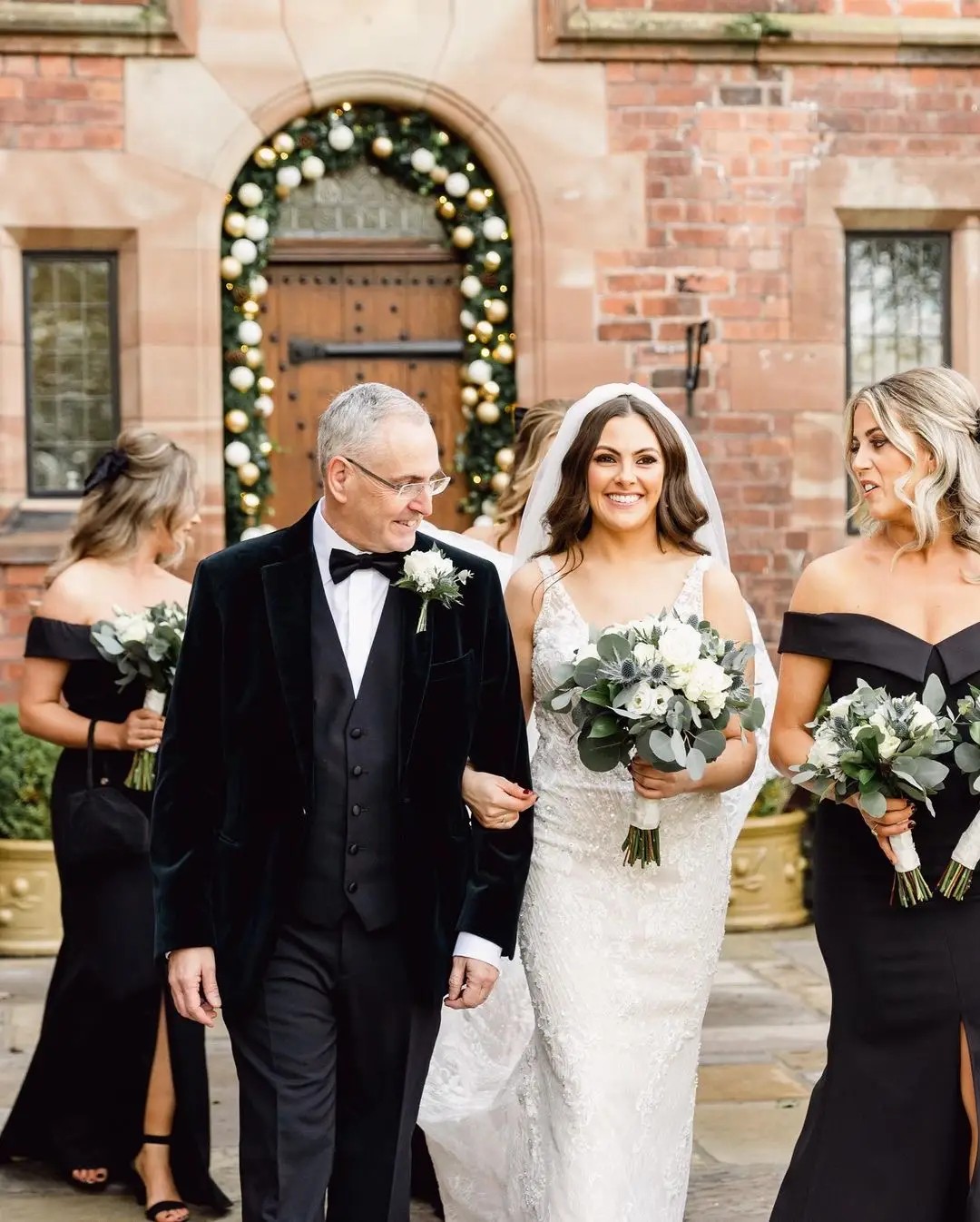 bride and her dad walking her down the asile