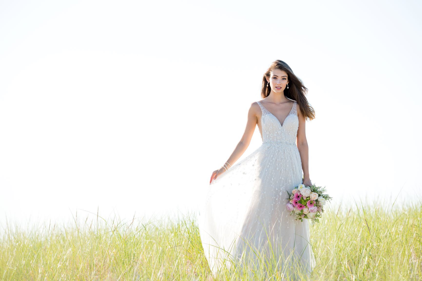 Brunette bride wearing white Martin Thornburg wedding dress